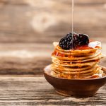 honey-pouring-over-a-stack-of-mini-pancakes