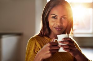 young-black-woman-drinking-a-cup-of-fresh-coffee