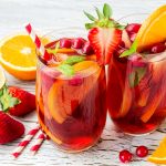 Cranberry drink, homemade lemonade or sangria with citrus fruits and berries