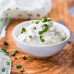 Fresh cream cheese spread with herbs in a bowl