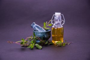 tulsi-oil-or-holy-basil-oil-with-mortar-and-pestle