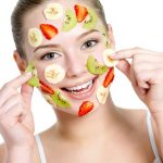 beautiful woman with fruit facial mask