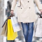 woman walking with shopping bags with christmas background