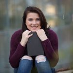 Young woman with distressed jeans