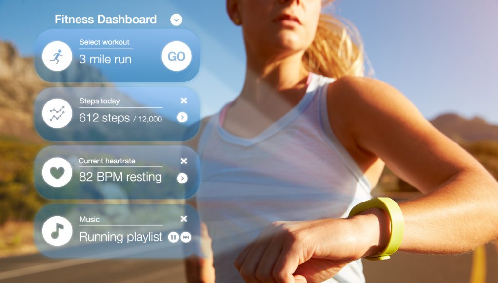 exercising-woman-checking-notifications-on-health fitness wearables
