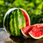 fresh-sliced-watermelon-wooden-backgroundripe-striped