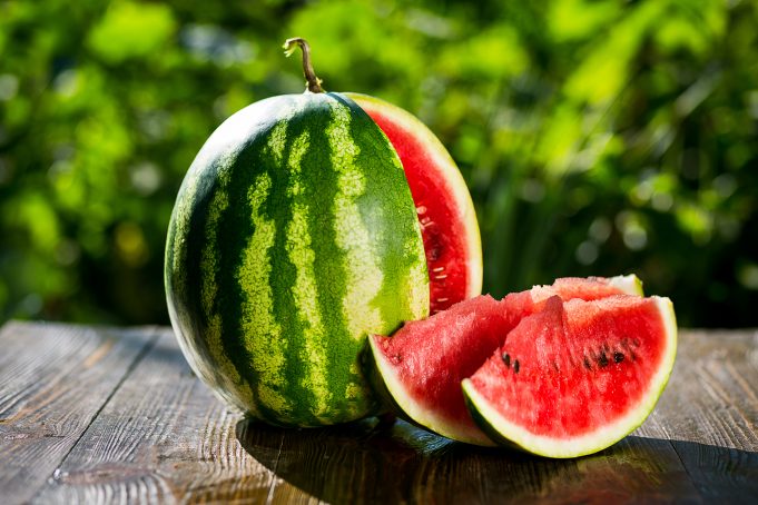 fresh-sliced-watermelon-wooden-backgroundripe-striped fruit