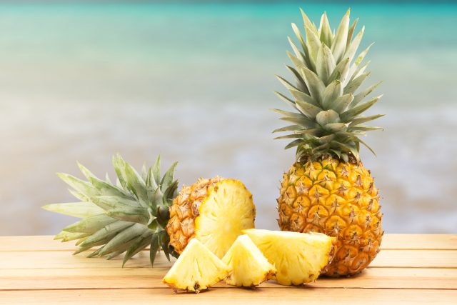 pineapple-on-wooden-table-tropical-landscape pineapples