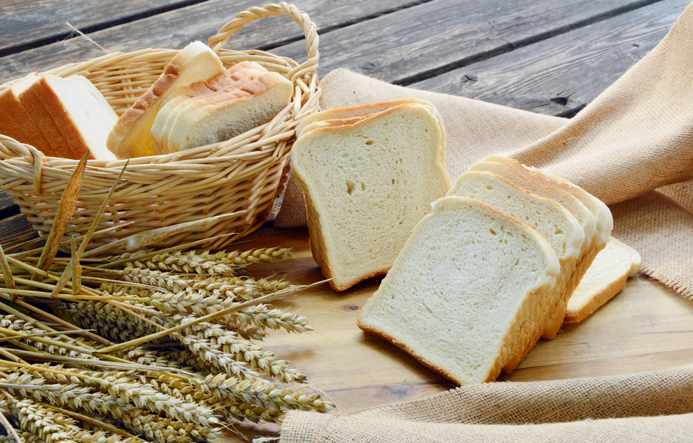 white-bread-sliced-basket-on-wooden-448631695