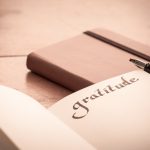 notebook-on-wooden-table-gratitude-journal