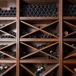 wine-cellar-bottles-on-wooden-shelves