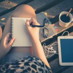 young-hipster-woman-writing-journal-on