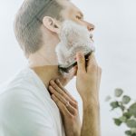 man-shaving-mirror-white