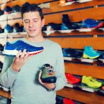 customer-comapring-shoe-prices-shopping