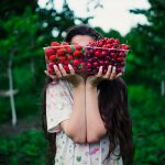 woman-holding-berries-wild