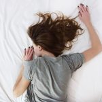 woman-sleeping-face-down-bed