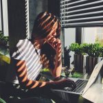 woman-sun-kissed-work-laptop