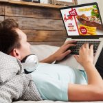 man-laptop-bed-online-food-order